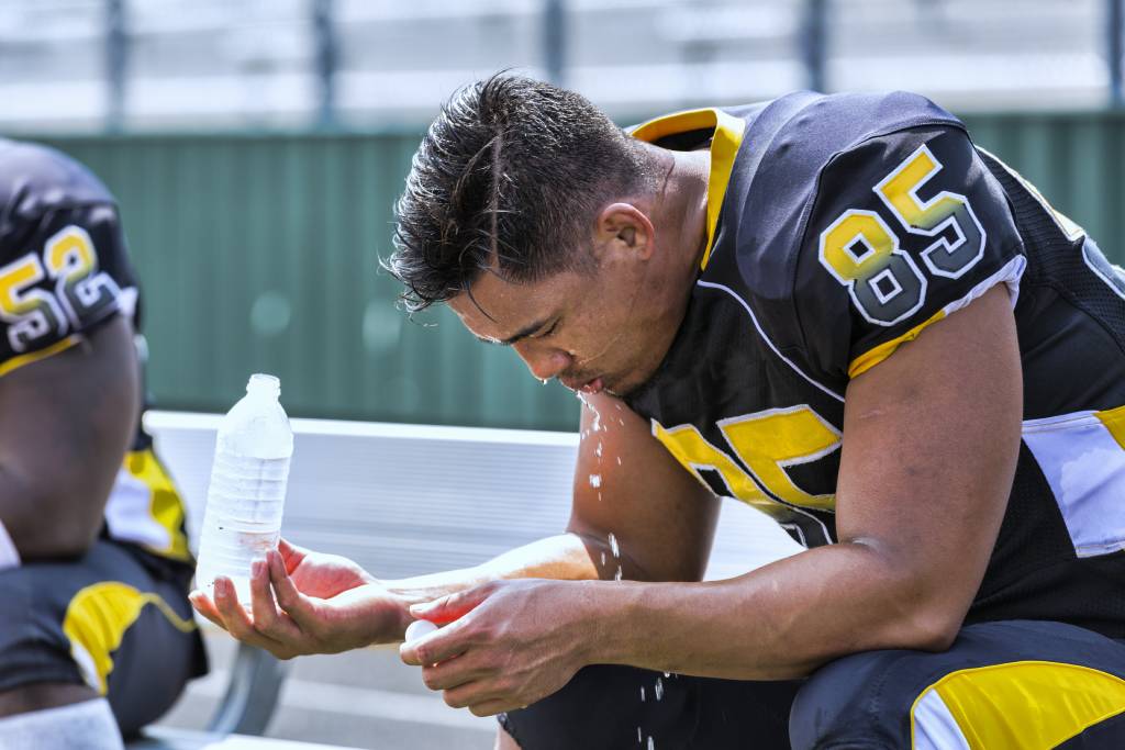 Football Player Drinking Water